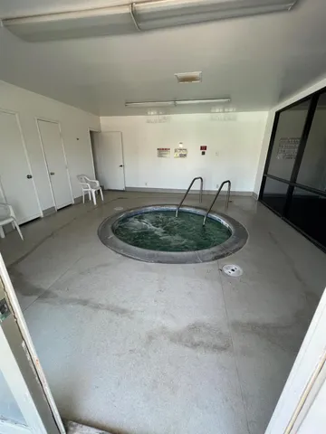 a view of swimming pool with furniture