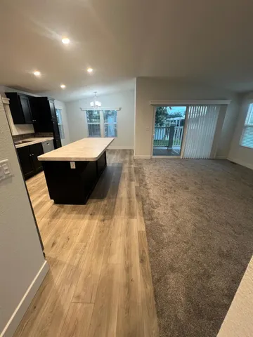 a view of balcony with wooden floor