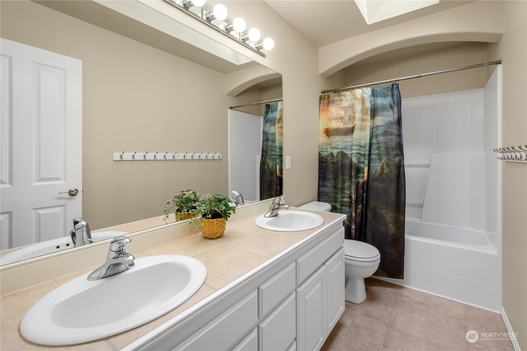 20619 38th Drive Southeast Bothell, WA 98021 - Photo 23 of 31 a bathroom with a sink and a mirror