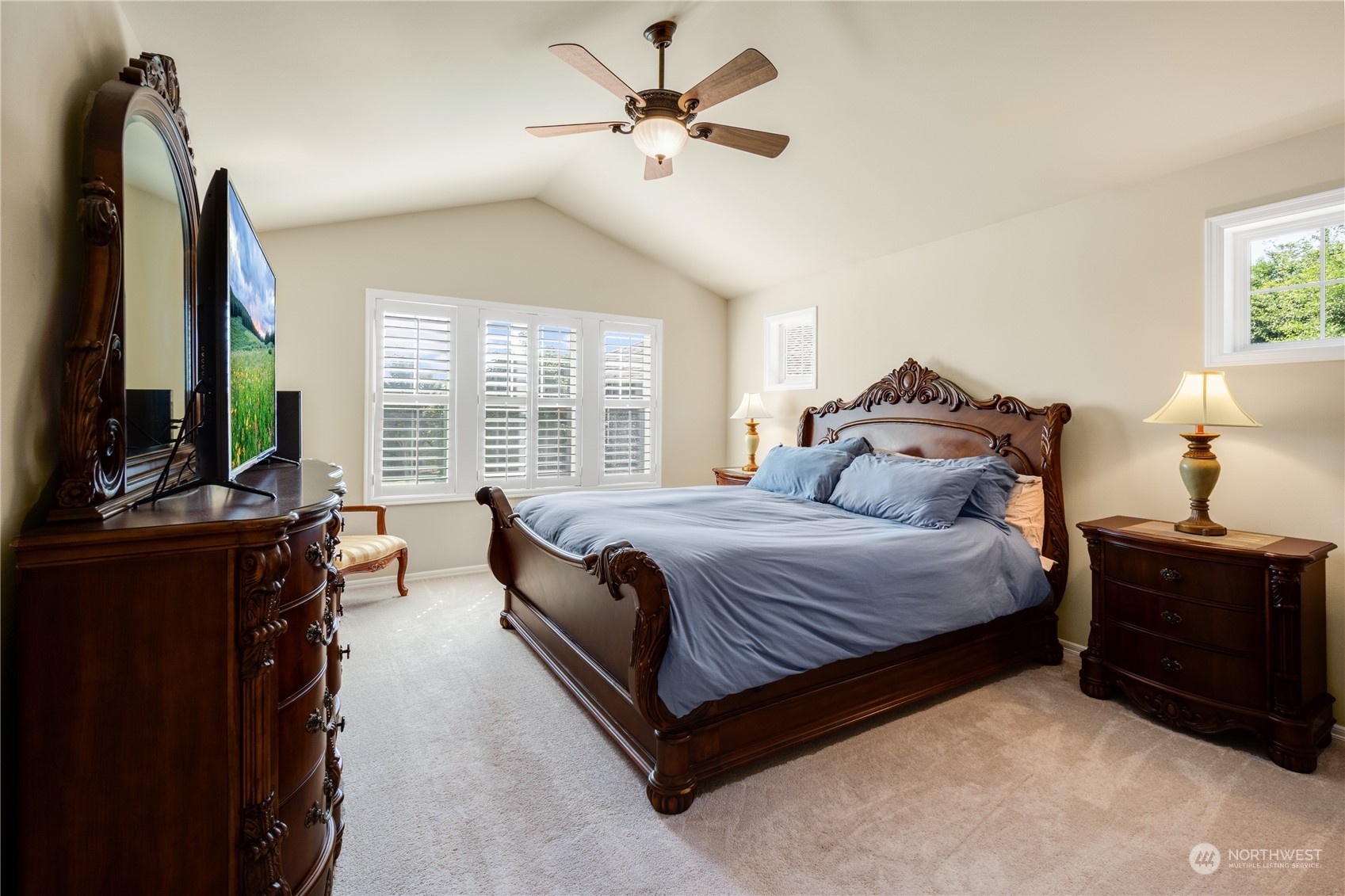 20619 38th Drive Southeast Bothell, WA 98021 - Photo 6 of 31 a spacious bedroom with a bed and a chandelier