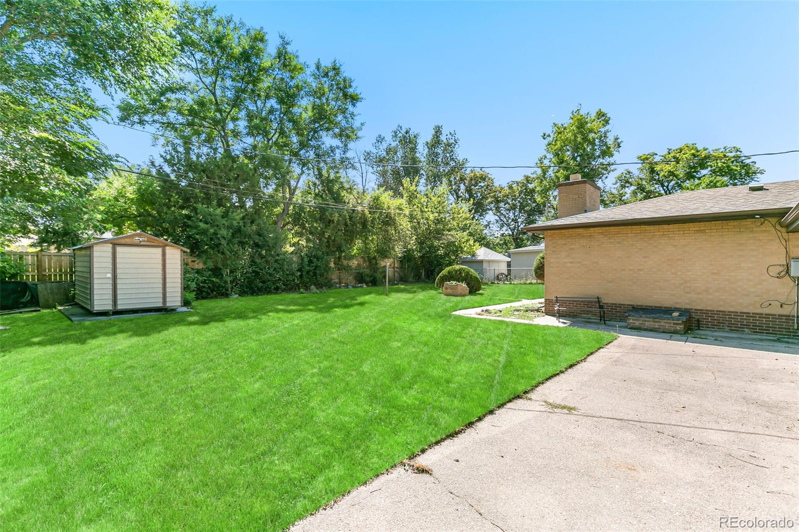 4650 Reed Street Wheat Ridge, CO 80033 - Photo 36 of 40 a view of a back yard with green space