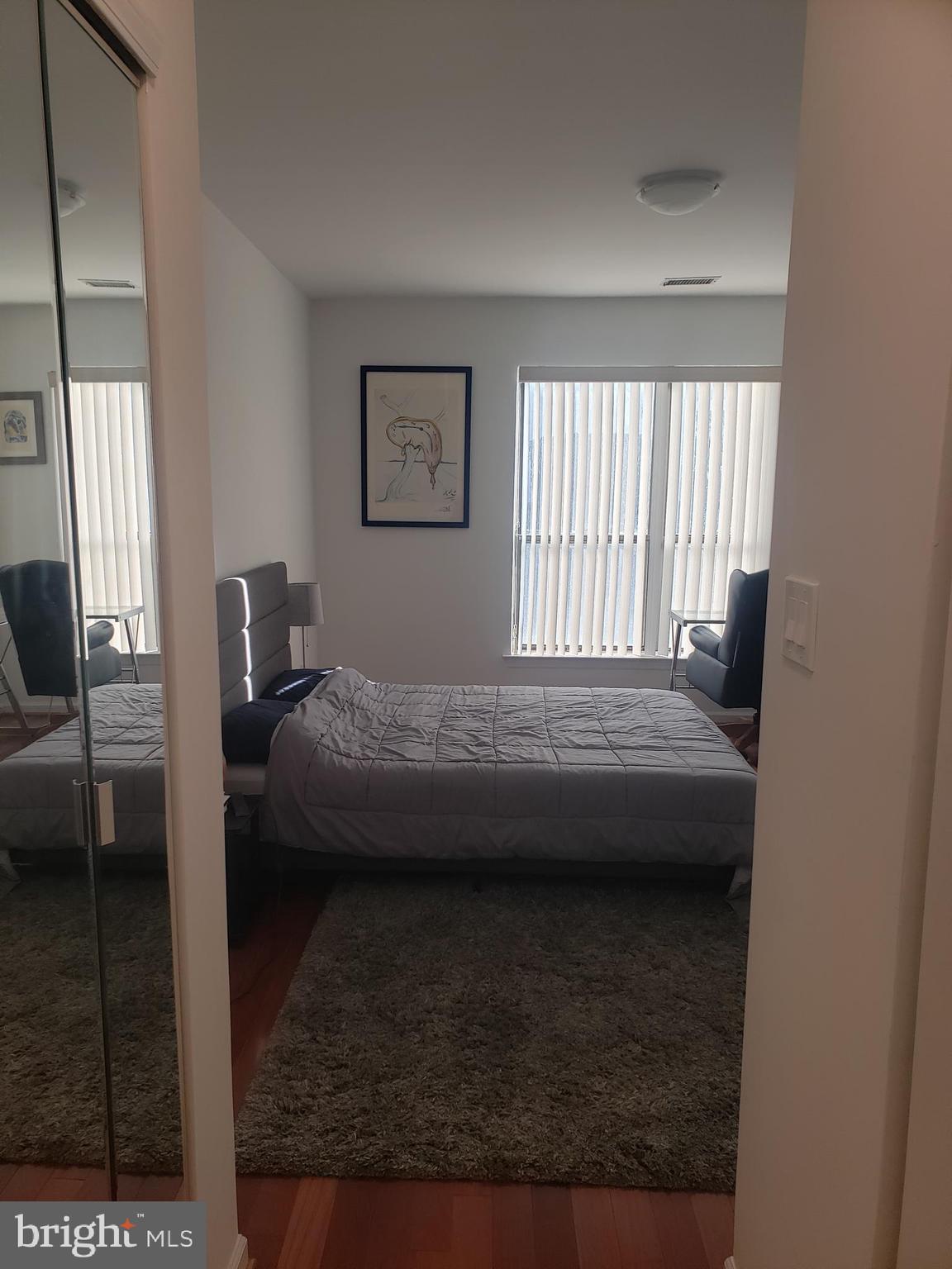 301 Byberry Road, Unit F7 Philadelphia, PA 19116 - Photo 18 of 19 a bedroom with a bed a couch and a window