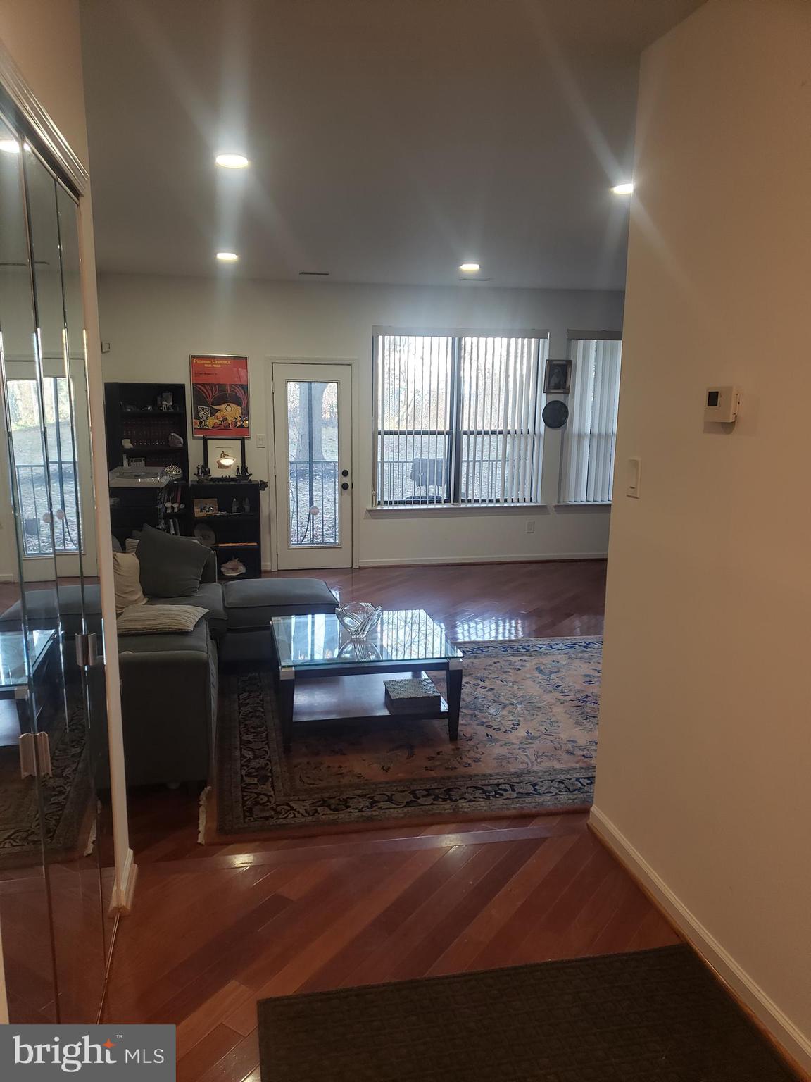 301 Byberry Road, Unit F7 Philadelphia, PA 19116 - Photo 6 of 19 a room with lots of wooden furniture and windows