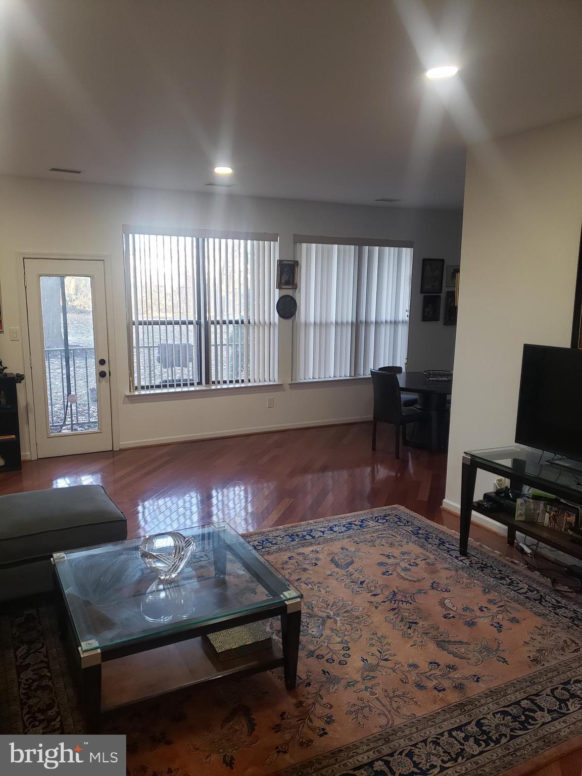 301 Byberry Road, Unit F7 Philadelphia, PA 19116 - Photo 7 of 19 a living room with furniture and a flat screen tv