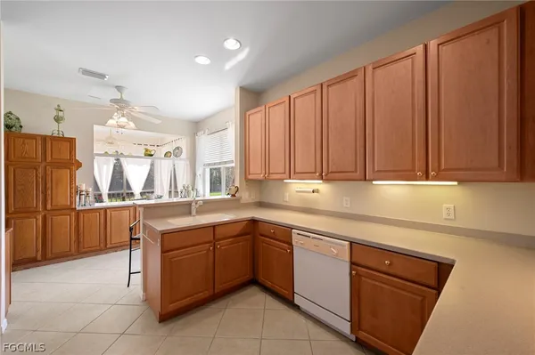 a kitchen with a refrigerator sink and stove