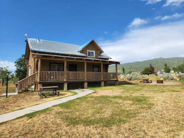 12615 Cedar Ridge Drive, Unit C41 Fairview, UT 84629 - Photo 26 of 32 View of front facade featuring a porch and a front yard