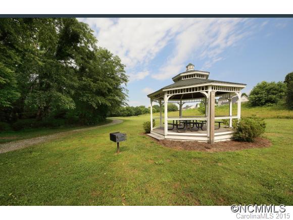 55 English Oak Road Fletcher, NC 28732 - Photo 17 of 17 a view of a house with a yard and sitting area