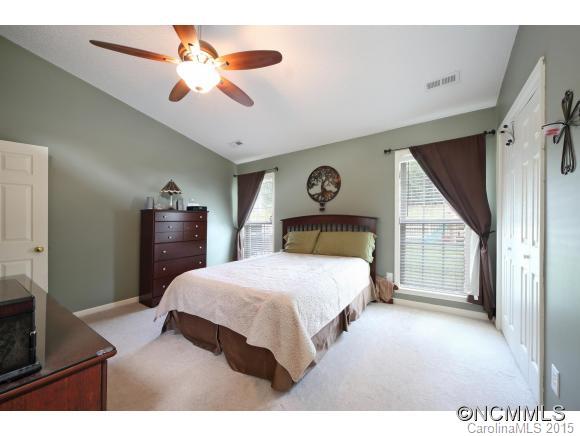 55 English Oak Road Fletcher, NC 28732 - Photo 6 of 17 a bedroom with a bed and a chandelier