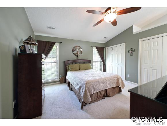 55 English Oak Road Fletcher, NC 28732 - Photo 7 of 17 a bedroom with a bed and a chandelier
