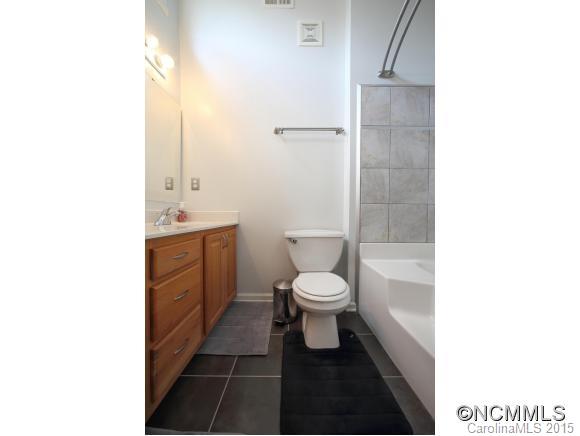 55 English Oak Road Fletcher, NC 28732 - Photo 8 of 17 a bathroom with a toilet a sink and a shower