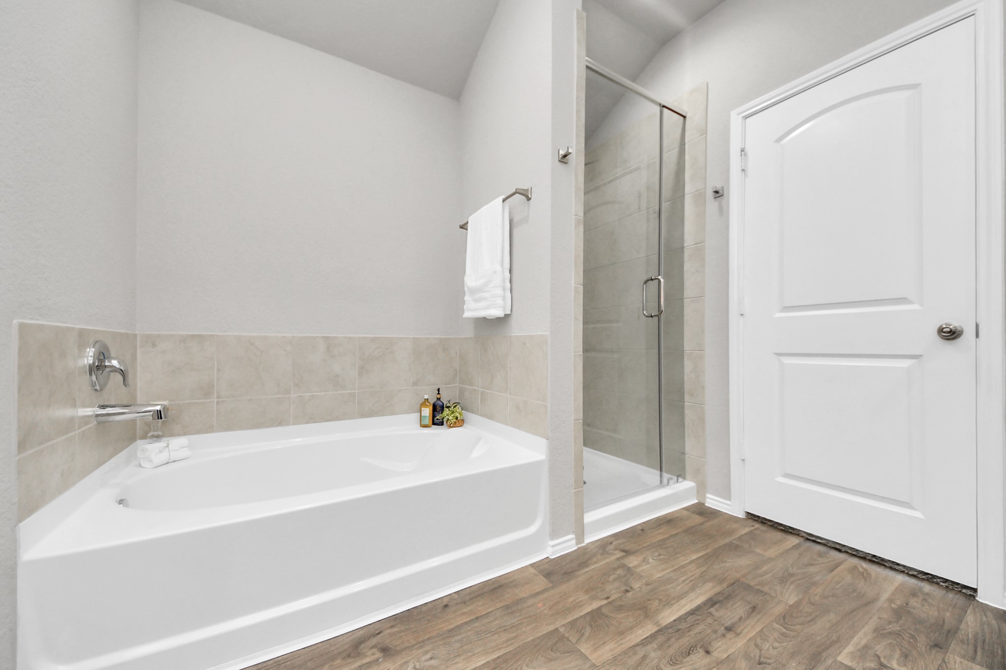 22906 Modica Rift Lane Katy, TX 77449 - Photo 11 of 27 a bathroom with a bathtub and shower