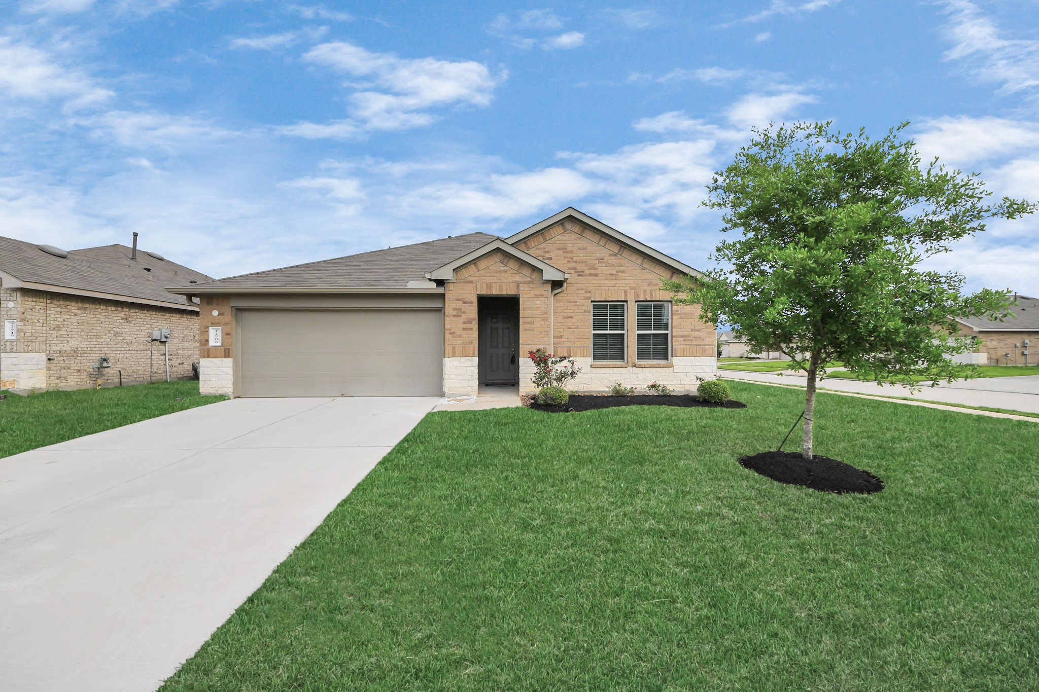 22906 Modica Rift Lane Katy, TX 77449 - Photo 2 of 27 a front view of a house with a yard