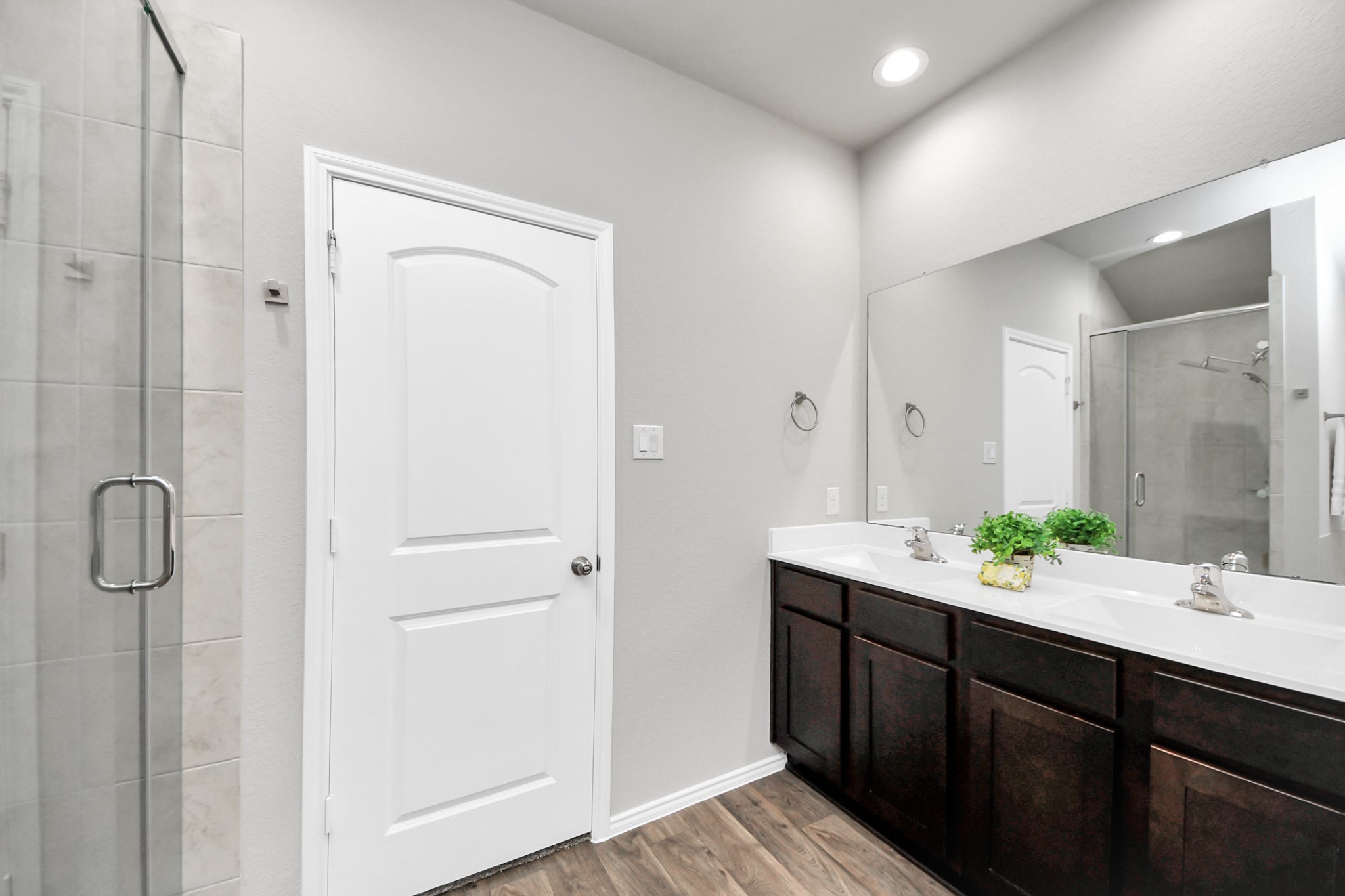 22906 Modica Rift Lane Katy, TX 77449 - Photo 8 of 27 a bathroom with a double vanity sink and mirror