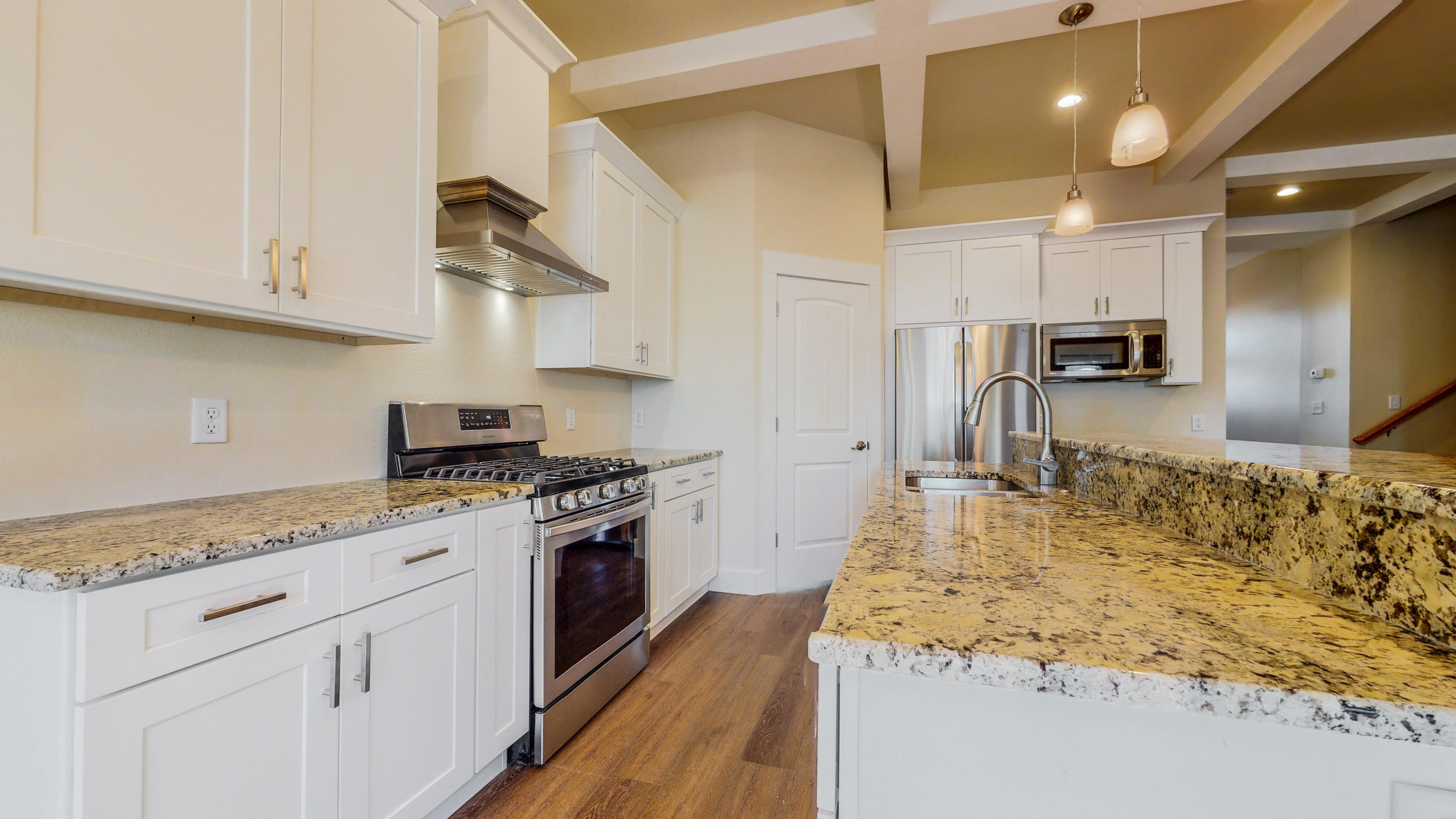 512 Harborview Circle Niceville, FL 32578 - Photo 13 of 42 a kitchen with kitchen island granite countertop a sink stove and refrigerator