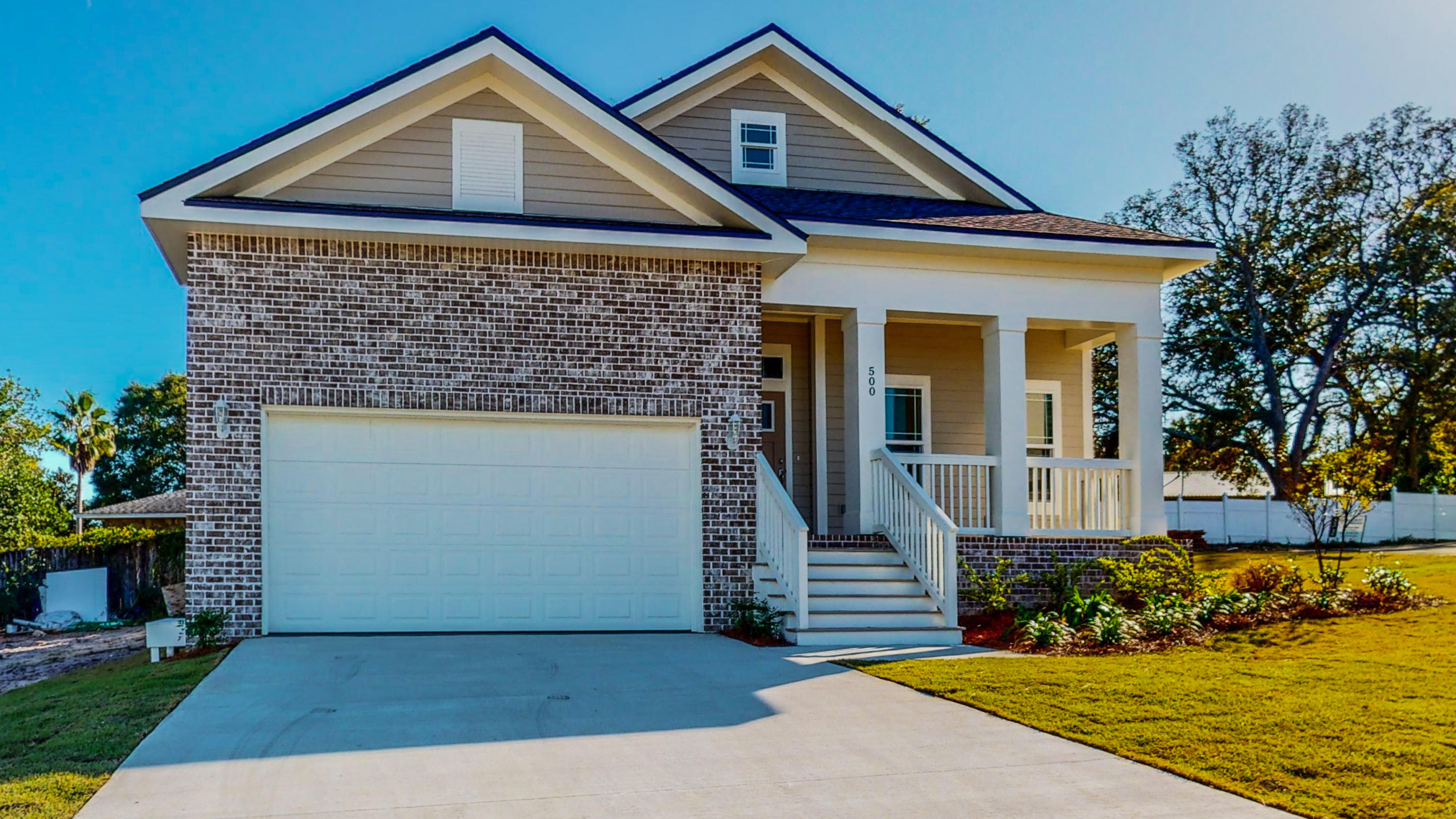 512 Harborview Circle Niceville, FL 32578 - Photo 2 of 42 a front view of a house with a yard