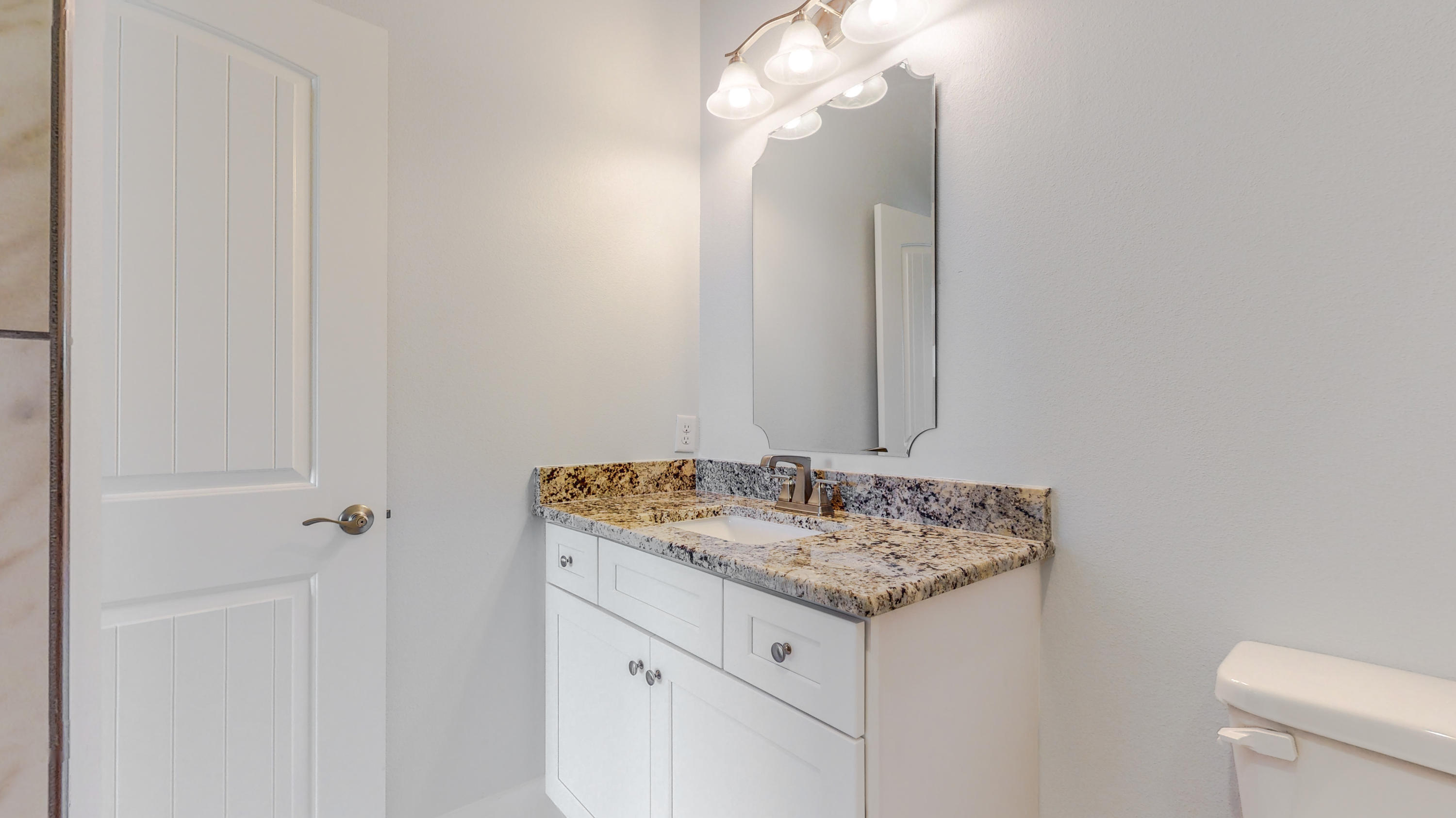512 Harborview Circle Niceville, FL 32578 - Photo 27 of 42 a bathroom with a granite countertop sink and a mirror