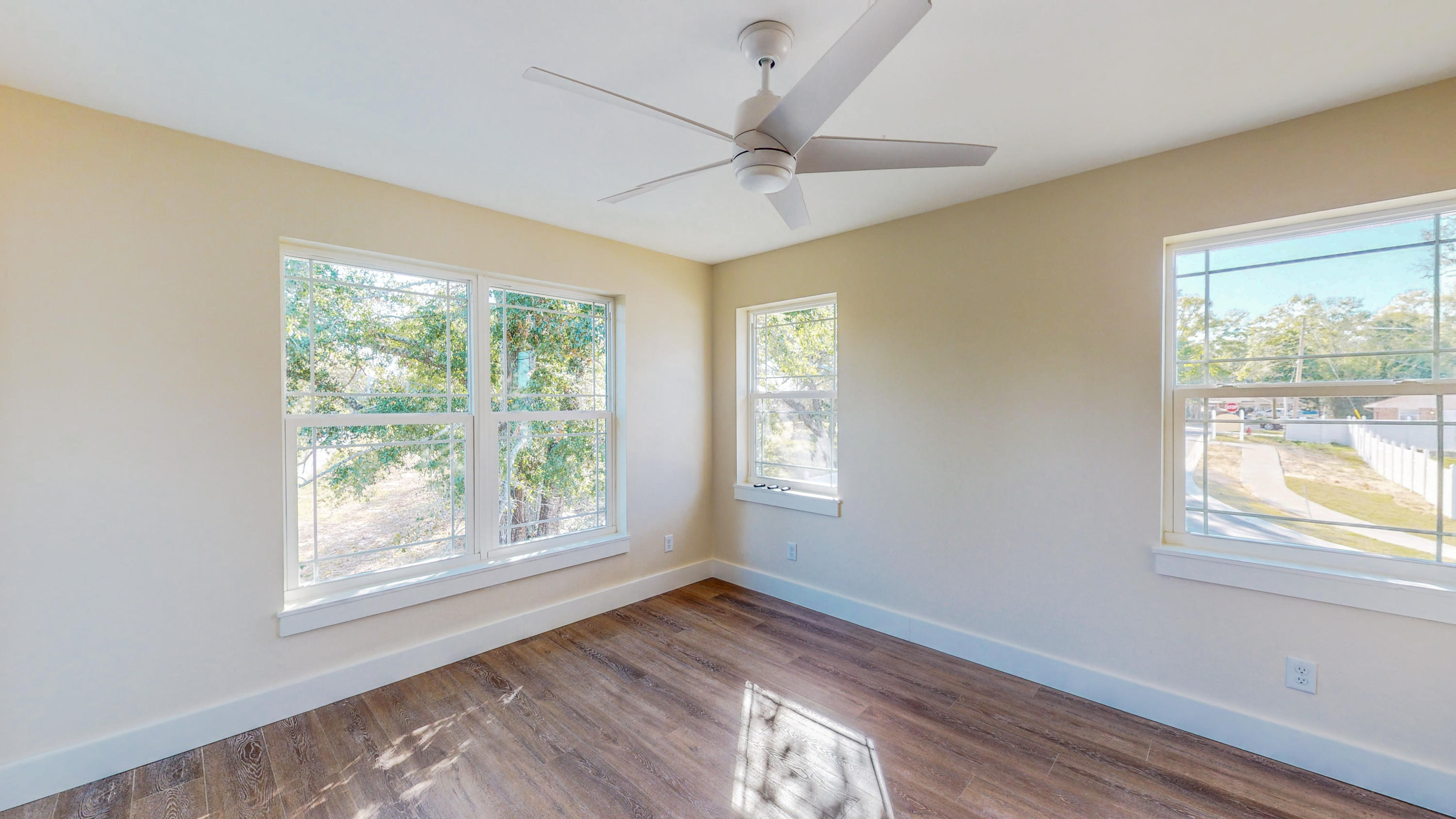 512 Harborview Circle Niceville, FL 32578 - Photo 31 of 42 a view of an empty room with wooden floor and a window