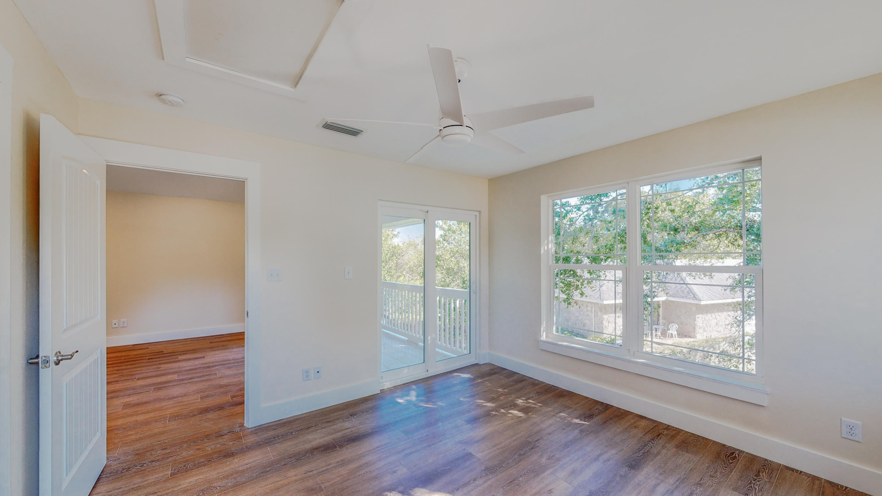 512 Harborview Circle Niceville, FL 32578 - Photo 32 of 42 a view of an empty room with wooden floor and a window