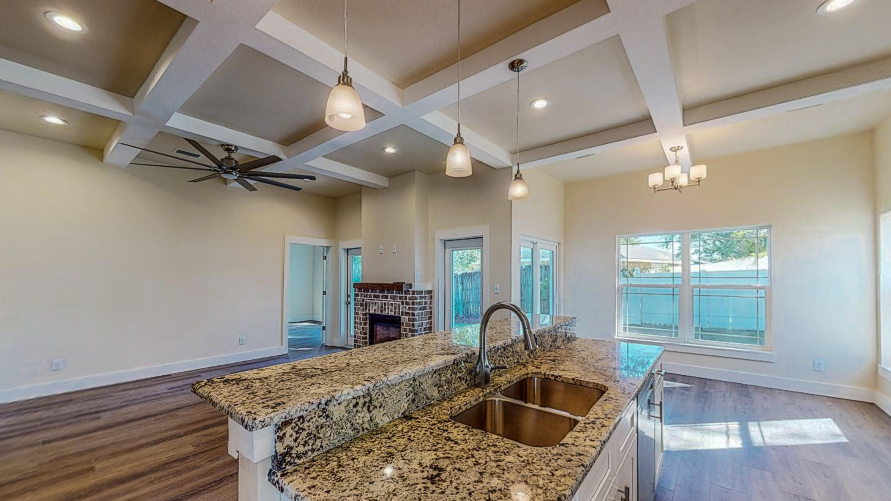 512 Harborview Circle Niceville, FL 32578 - Photo 9 of 42 a kitchen with stainless steel appliances kitchen island granite countertop a sink stove and cabinets