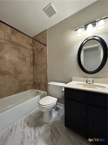 a bathroom with a sink a toilet and a bathtub