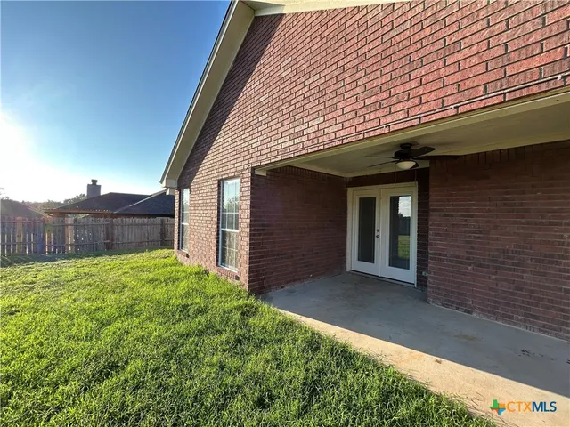 a view of a backyard of the house