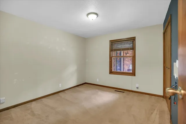 a view of a room with window and bathroom