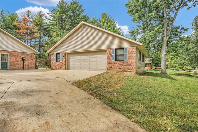 a front view of a house with garage