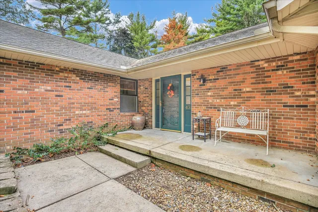 a backyard of a house with outdoor seating