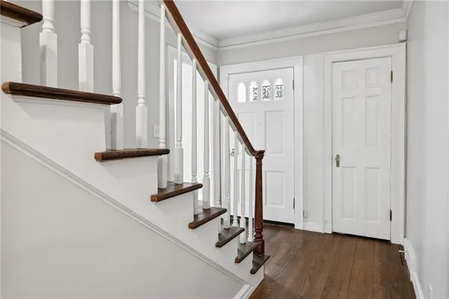 a view of staircase with wooden floor and staircase