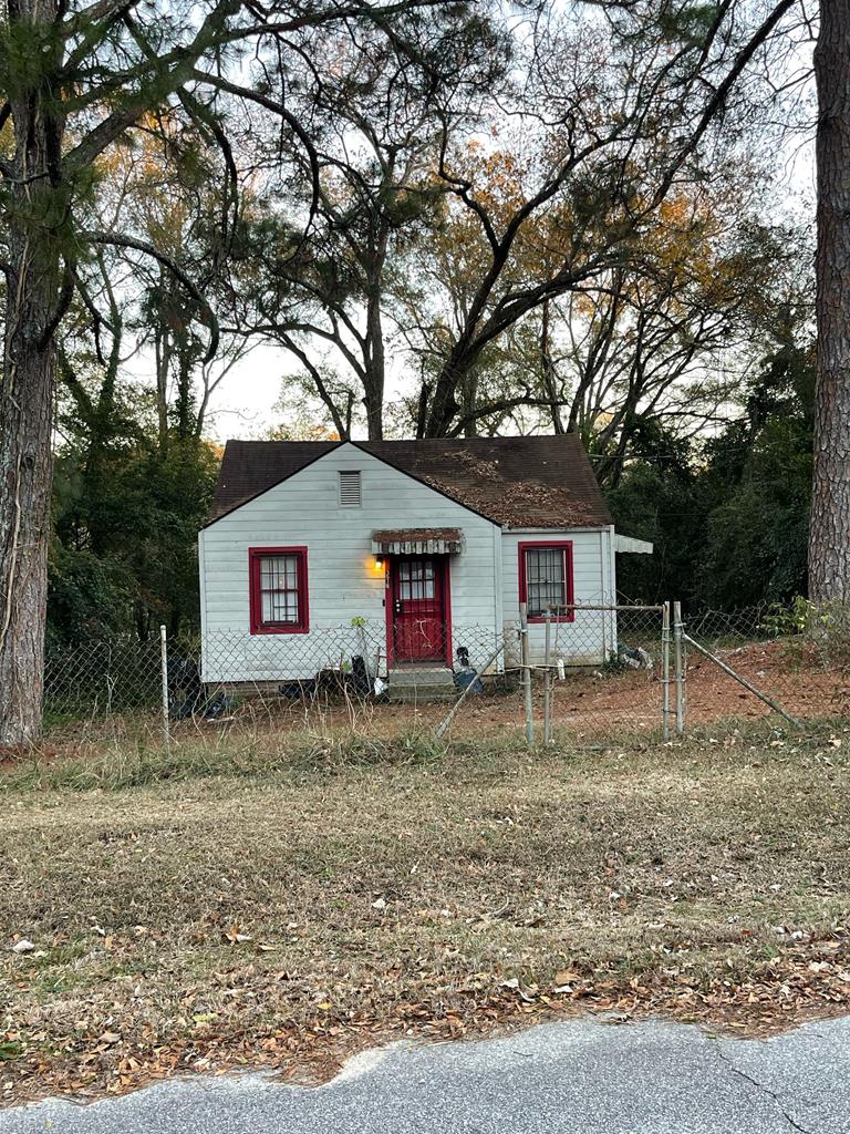 a house view with a backyard space