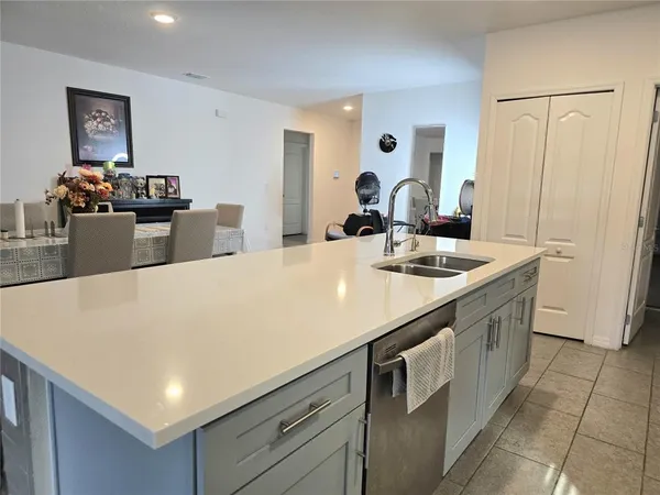 a kitchen with stainless steel appliances a sink and stove