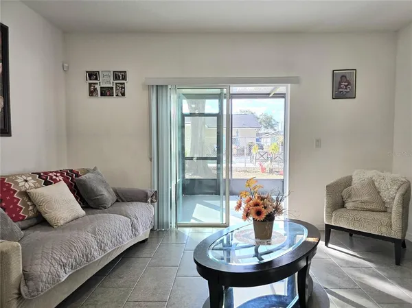 a living room with furniture and a window