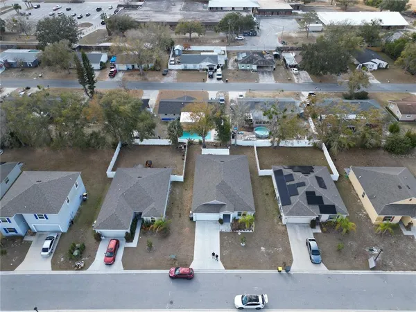 an aerial view of residential houses with outdoor space