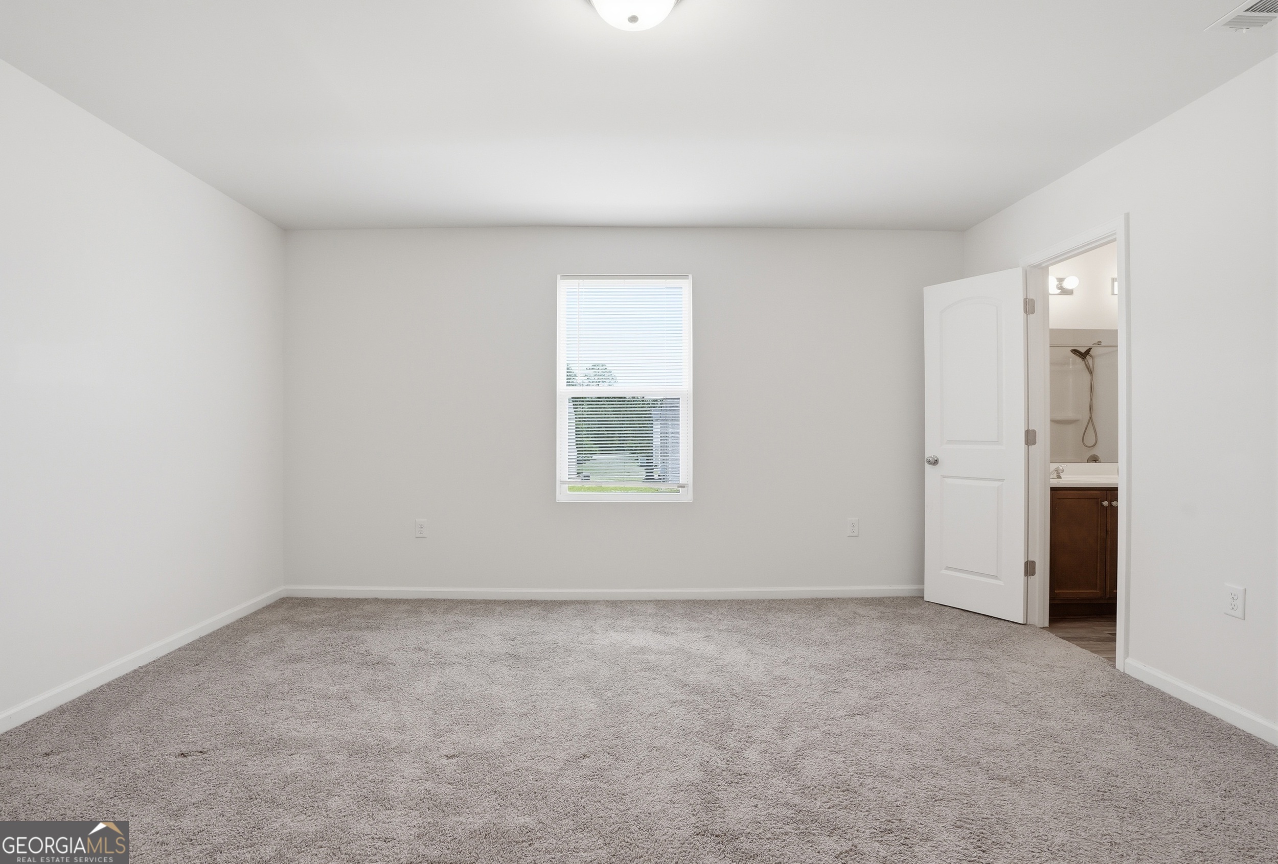 225 Rendell Lane Hinesville, GA 31313 - Photo 22 of 33 an empty room with a window