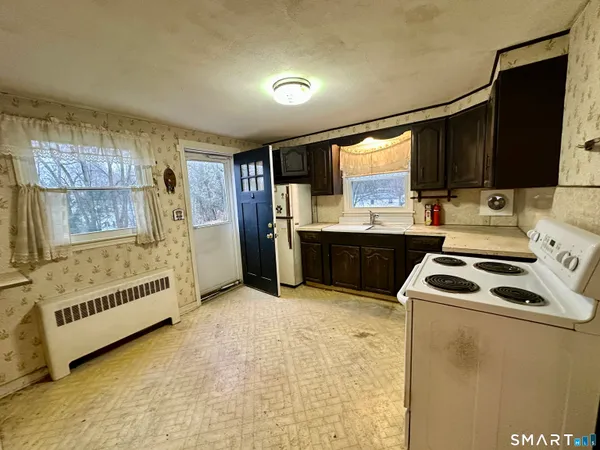 a kitchen that has a sink and a stove