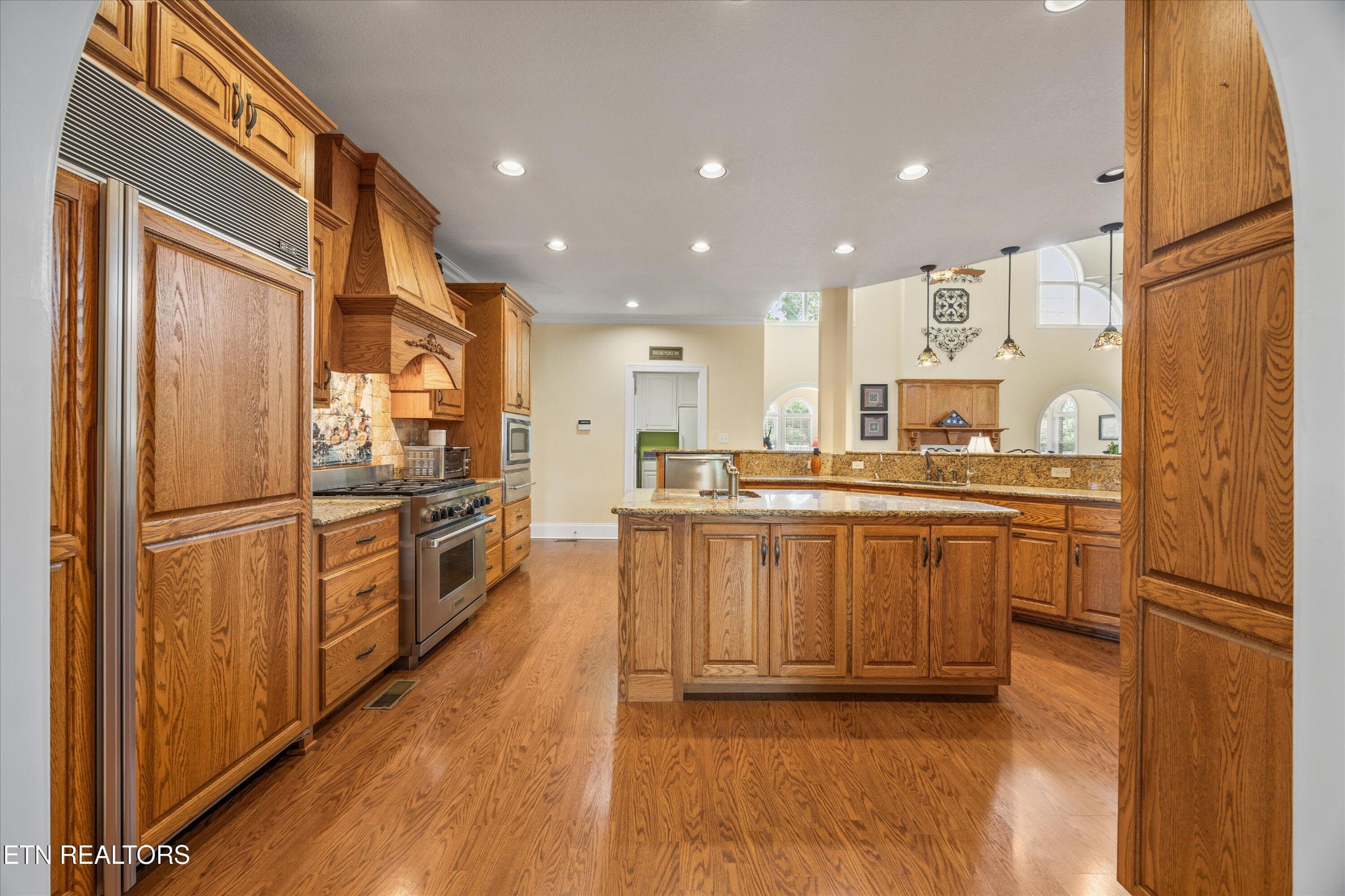 132 David Road Clinton, TN 37716 - Photo 21 of 52 a kitchen with kitchen island granite countertop appliances a sink and a refrigerator