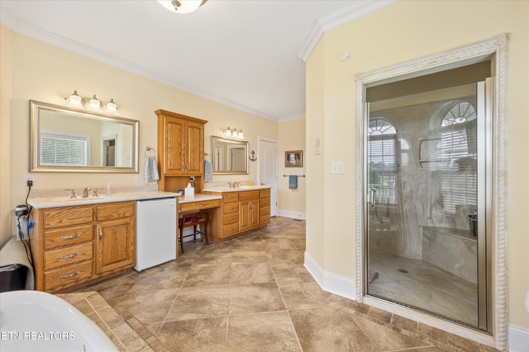 132 David Road Clinton, TN 37716 - Photo 29 of 52 a spacious bathroom with a shower sink and mirror