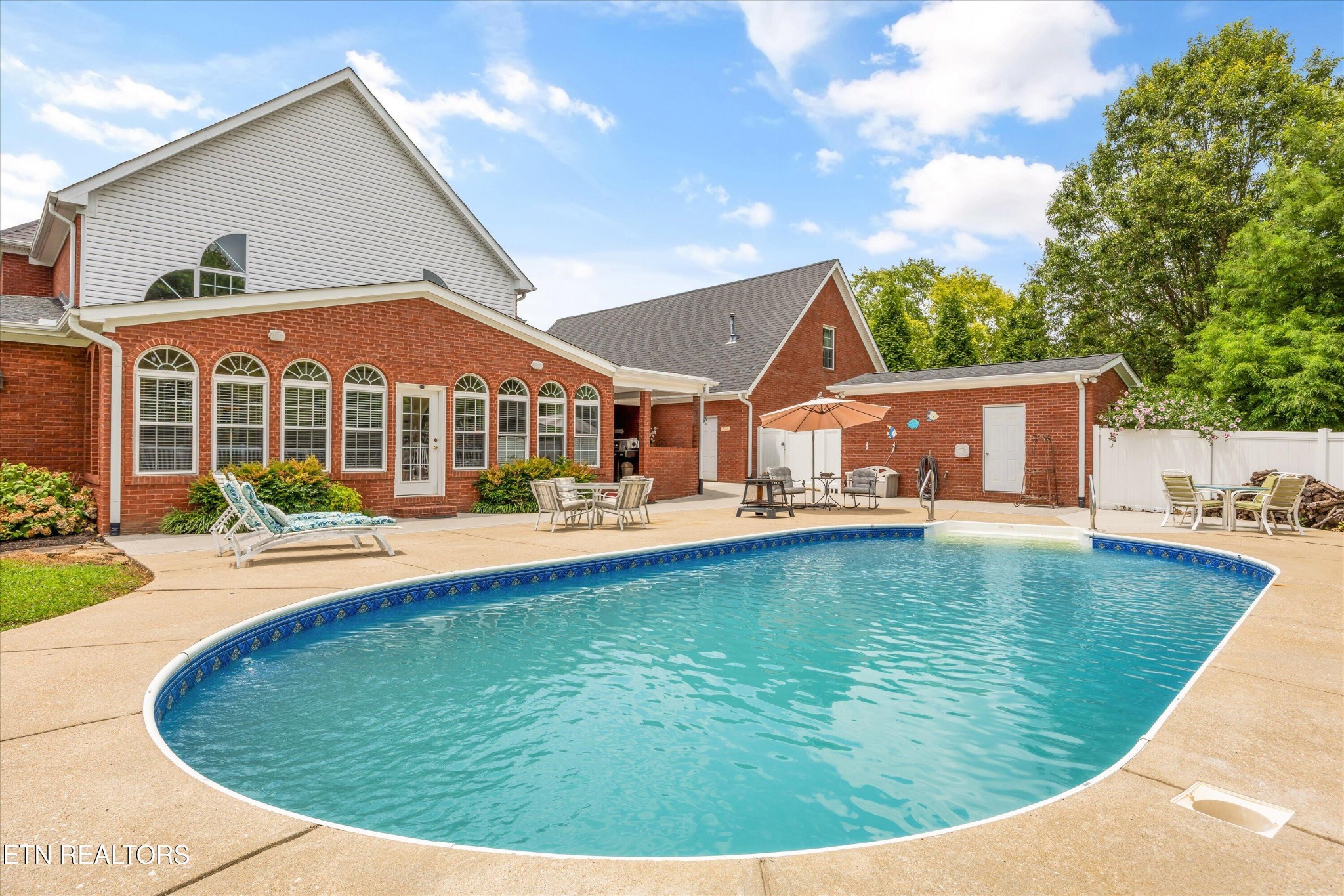 132 David Road Clinton, TN 37716 - Photo 36 of 52 a view of a house with swimming pool and porch
