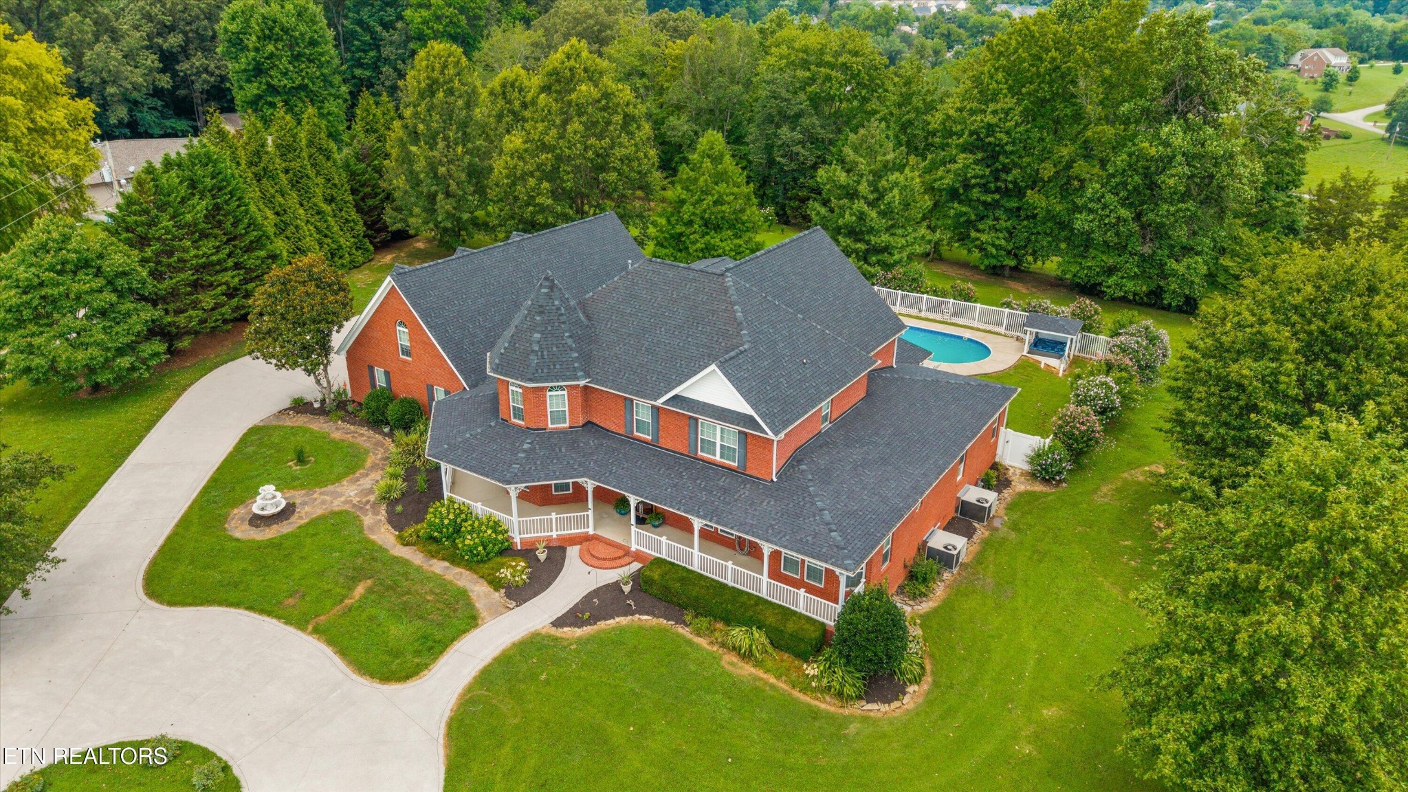 132 David Road Clinton, TN 37716 - Photo 47 of 52 an aerial view of a house with swimming pool and big trees