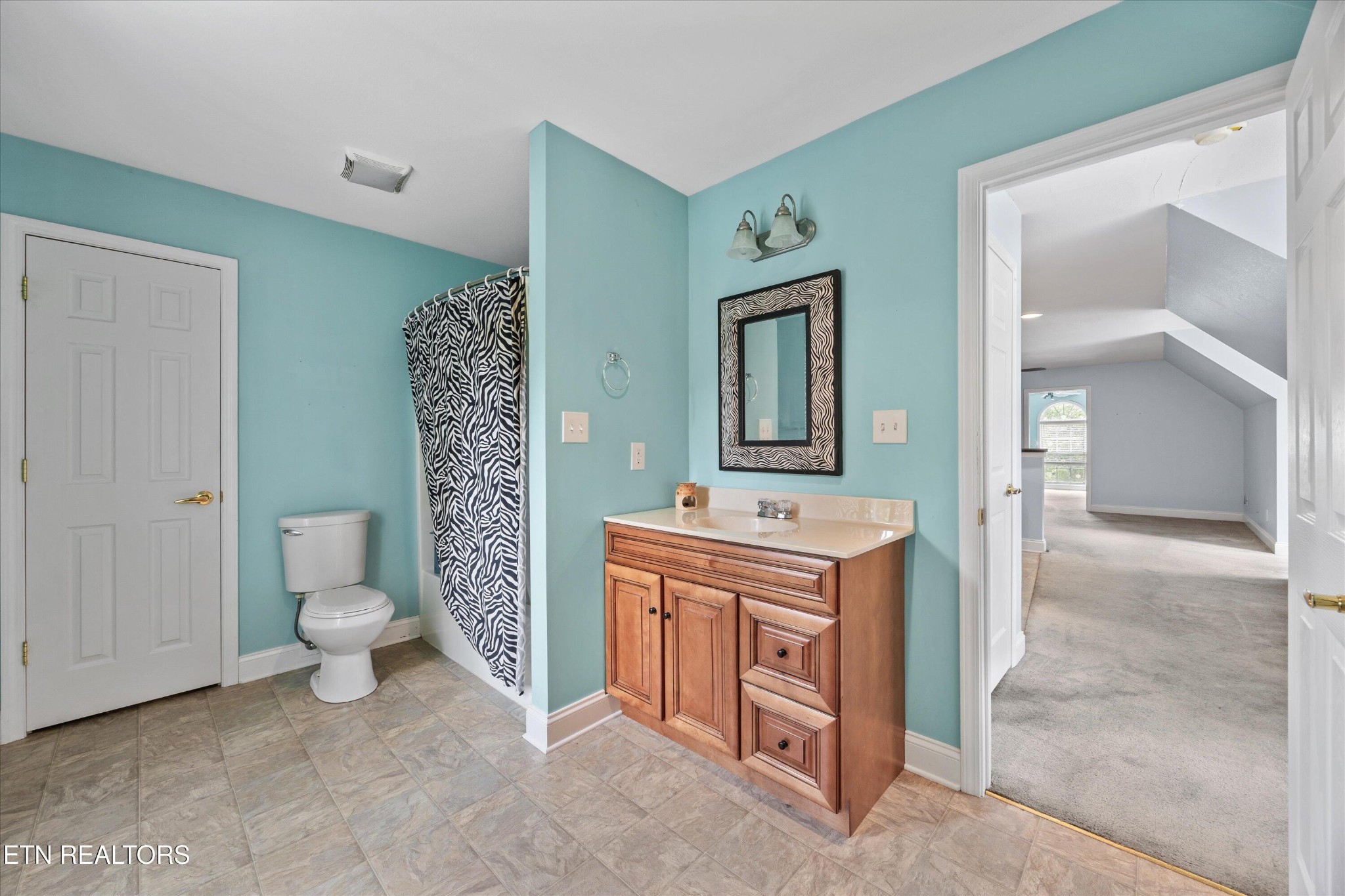 132 David Road Clinton, TN 37716 - Photo 51 of 52 a bathroom with a toilet sink and mirror