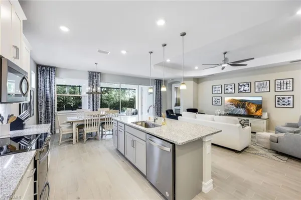a large white kitchen with a large window