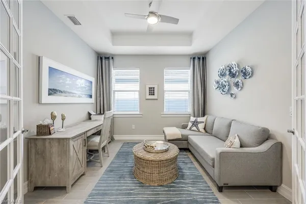 a living room with furniture and a large window
