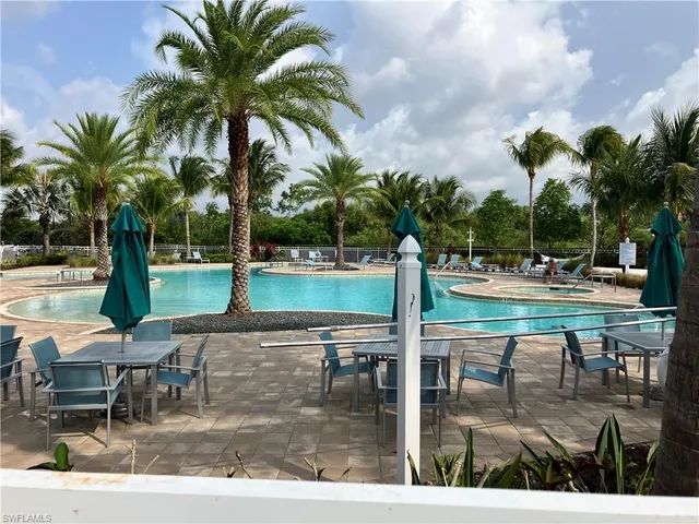 a view of a swimming pool with chairs
