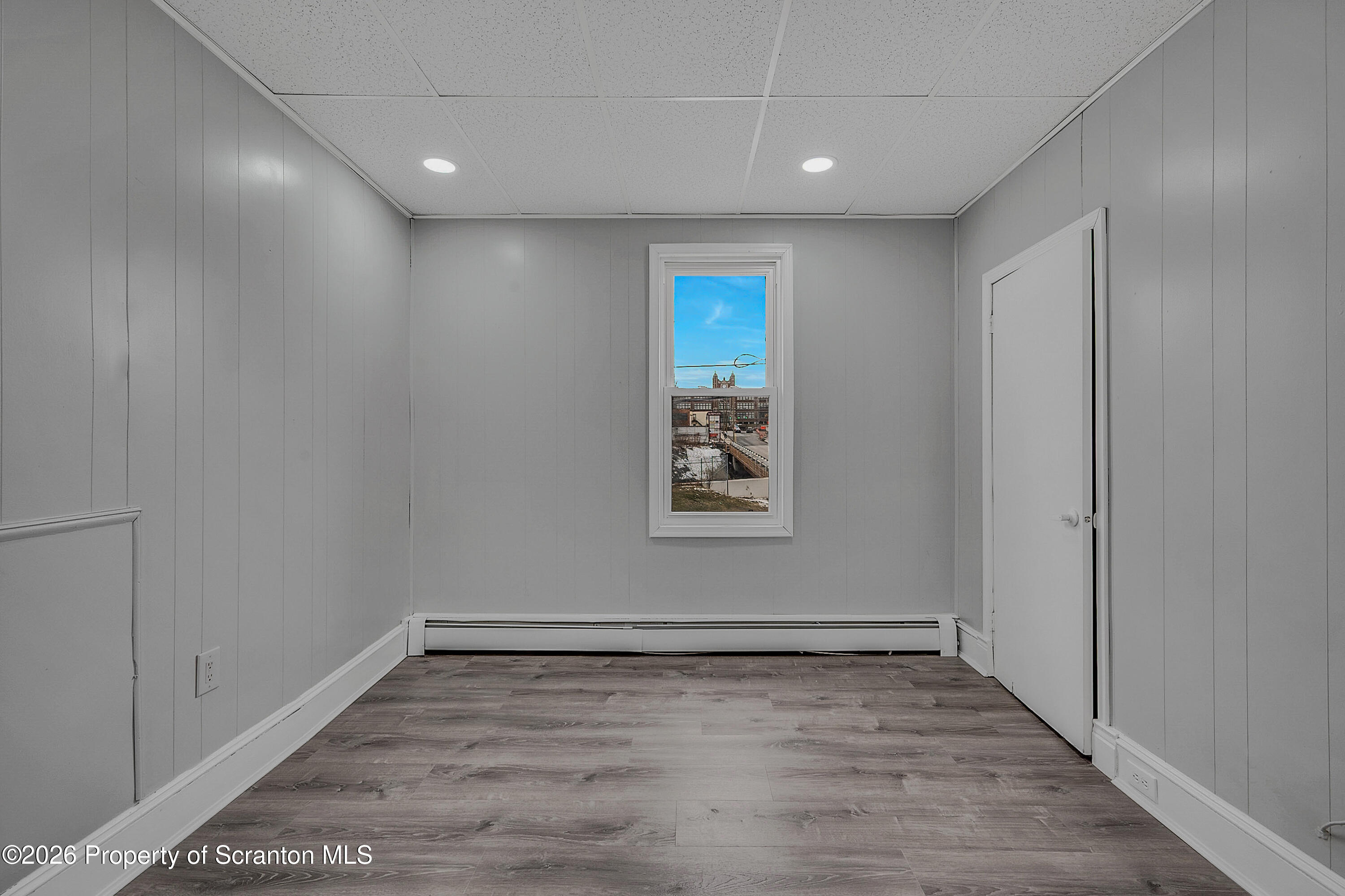 6 Green Ridge Street, Unit 2 Scranton, PA 18509 - Photo 12 of 20 a view of an empty room with wooden floor