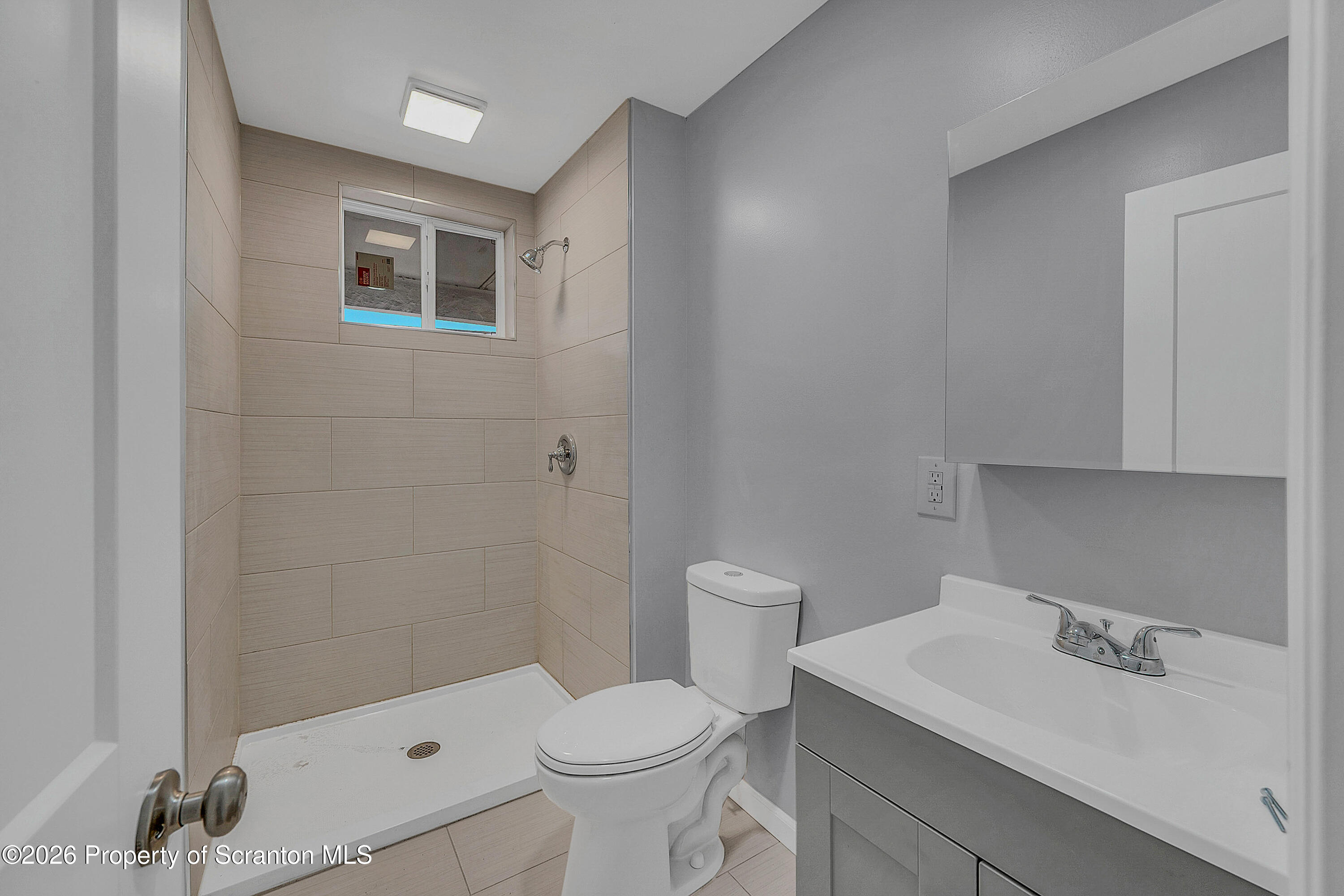 6 Green Ridge Street, Unit 2 Scranton, PA 18509 - Photo 10 of 20 a bathroom with a sink toilet and shower