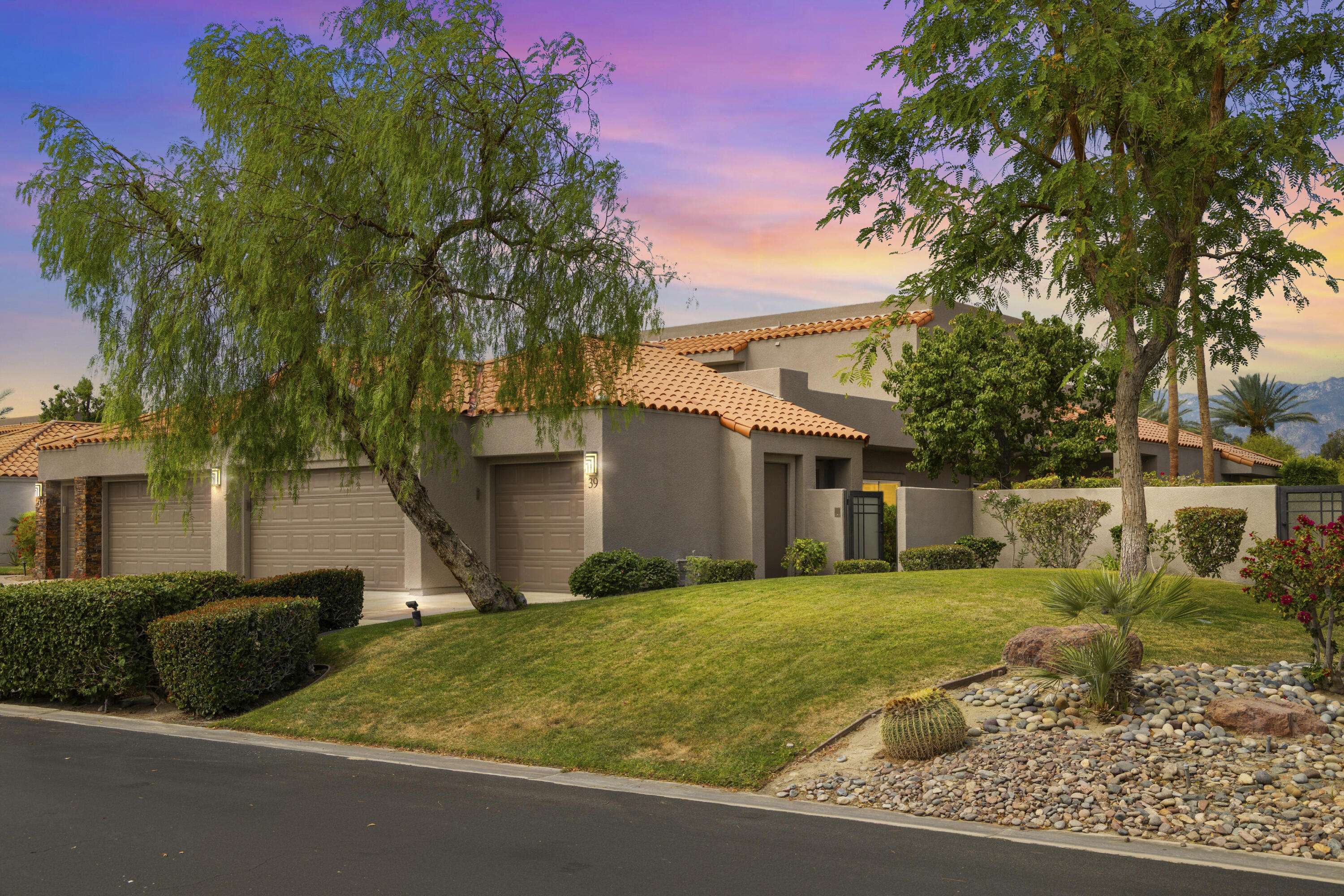 39 Augusta Drive Rancho Mirage, CA 92270 - Photo 53 of 53 a view of a house with a big yard and large trees