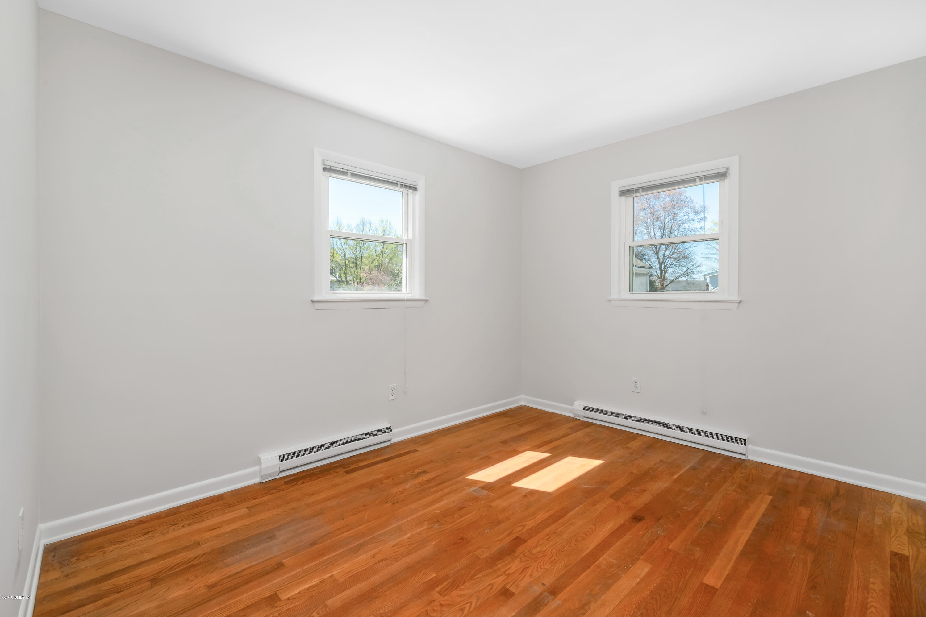 10 Oxer Place Greenwich, CT 06830 - Photo 17 of 22 an empty room with a window