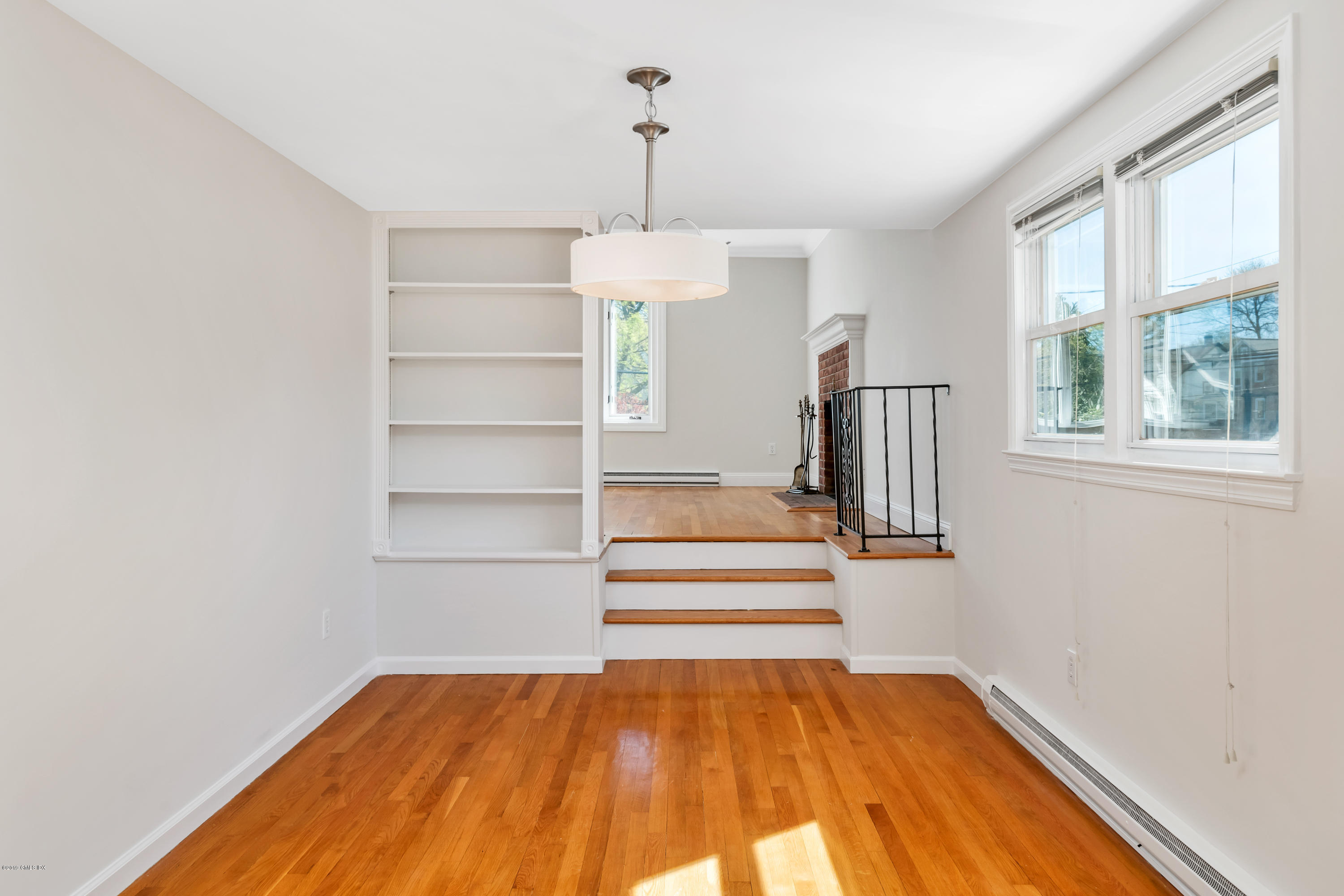 10 Oxer Place Greenwich, CT 06830 - Photo 5 of 22 a view of empty room with wooden floor and windows
