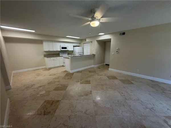 a view of a kitchen with a sink cabinets and window