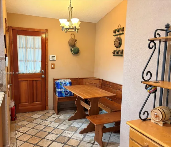 a room with table and chairs